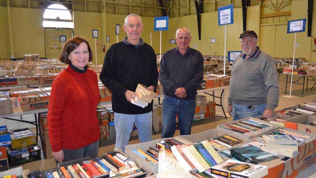 READY: Lifeline Book Fair volunteers Celia Ferguson, Greg Griffith, Alex Ferguson and John Frith. Photo: BRADLEY JURD 051917books2