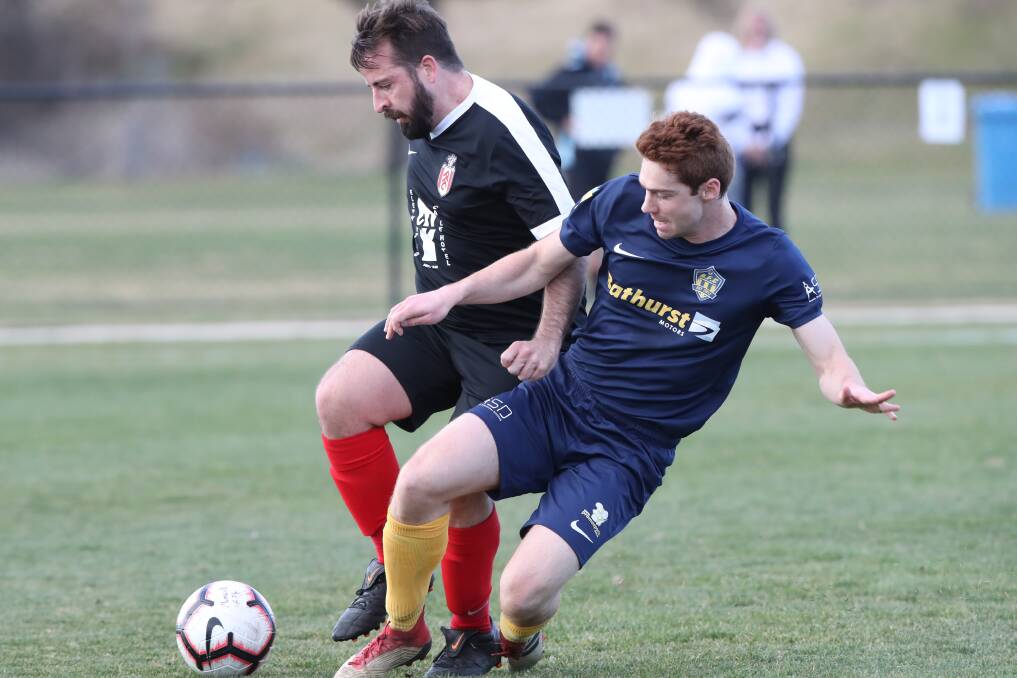 CHALLENGE: Panorama Black's Henry Simmons competes with Abercrombie's Greg Swanson for the ball in Sunday's match at Proctor Park. Photo: PHIL BLATCH 072819pbpano3