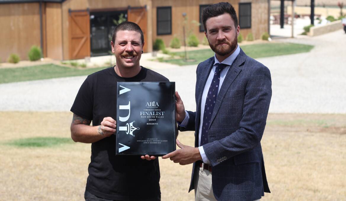FINALIST: BoxGrove co-owners Ben Bornen and Ben Fry with the ceremony finalist award from the Australian Bridal Industry Academy. Photo: BRADLEY JURD