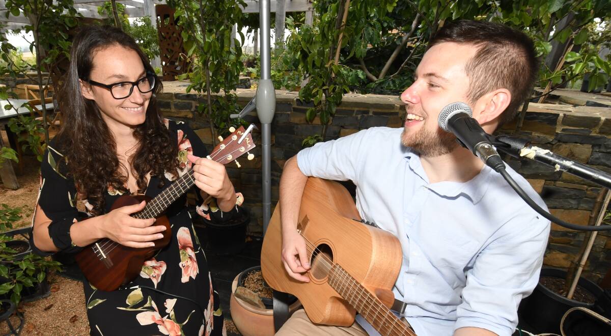 FRESH TUNES: Musicians Jodie Anderson and Aaron Strickland at the launch of Mayfield Garden Fresh Fiesta on Sunday. Photo: CHRIS SEABROOK 010619cmayfld1