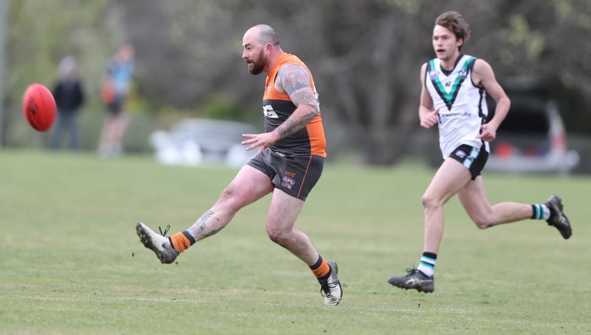 GAME ON: Bathurst Giants vice captain Shaun Noyen in action in last year's AFL Central West grand final against Bathurst Bushrangers, the last time the two teams played. Photo: CHRIS SEABROOK