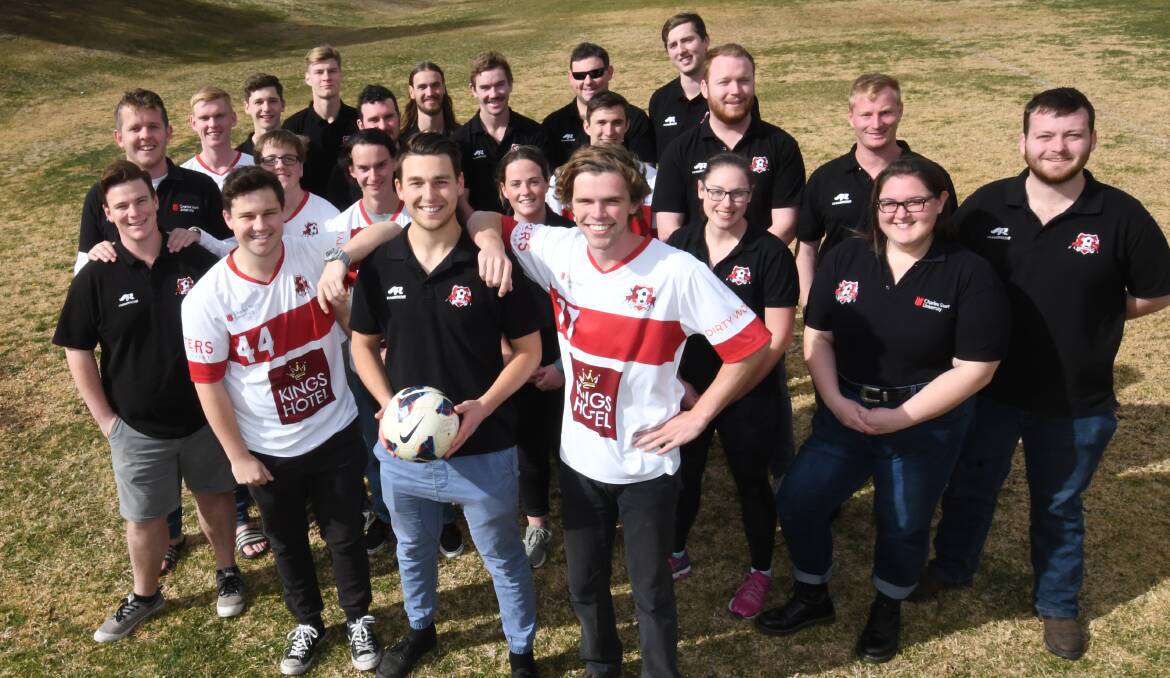 FUNDRAISING: Front, left Tom Dowell, Callum Cauduro and Jesse Wells with members of the CSU Football Club. Photo: CHRIS SEABROOK 080718cup