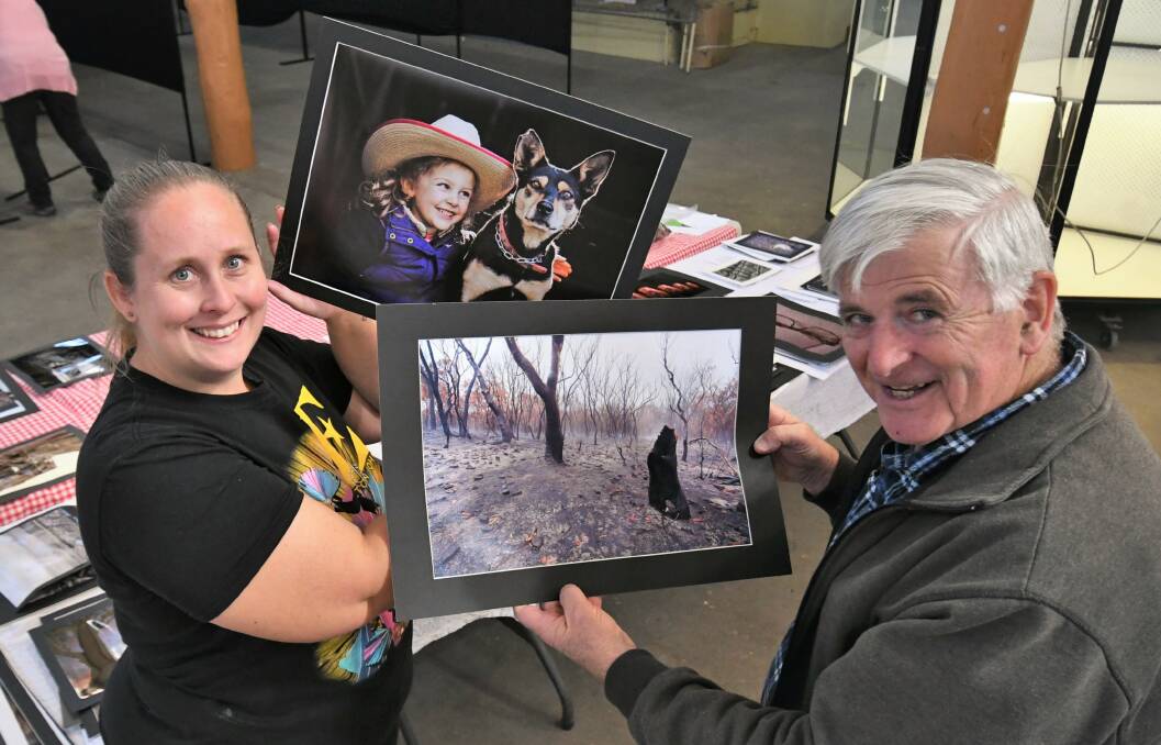 PICTURE THIS: Stewards, Melissa Kauter and Alan Sadleir with entries in the photography section for the Royal Bathurst Show. Photo: CHRIS SEABROOK 042621cshow1
