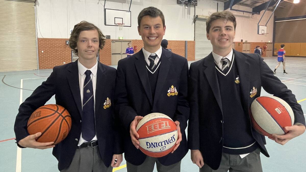 St Stanislaus' College basketball talents Angus Lang, James Pucci and Thomas Collins will be making good use of the backboards donated from the Bathurst Indoor Sports Stadium. Photo: BRADLEY JURD