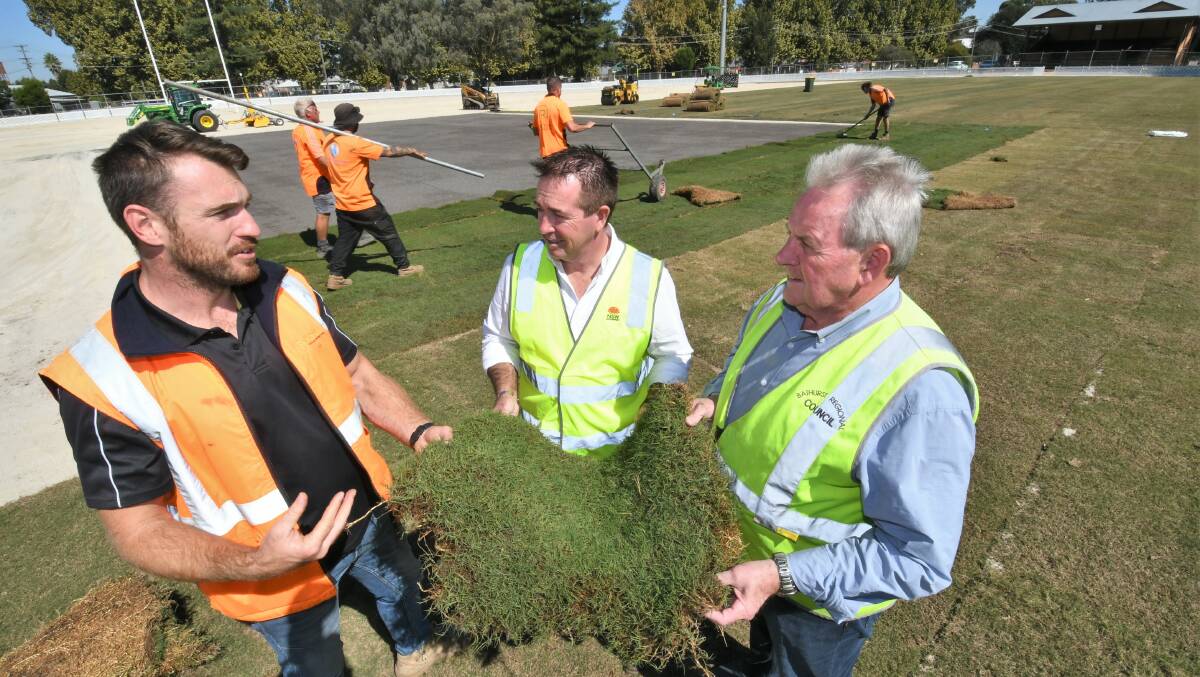 UPDATE: ROMBA project manager Luke Burgmann, Member for Bathurst and Deputy Premier Paul Toole and Bathurst mayor Robert Taylor inspecting the progress on the Sportsground's new cricket pitch and surrounds. Photo: CHRIS SEABROOK 040522csptsgrnd1