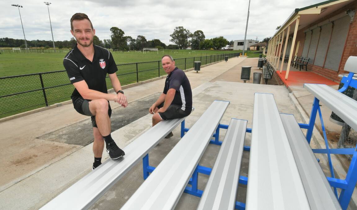 NEW LOOK: Andrew Speed, of Speed's Landscaping, and Panorama FC president Beau Yates with the new grandstands area at Proctor Park. Photo: CHRIS SEABROOK 020921cproctor2