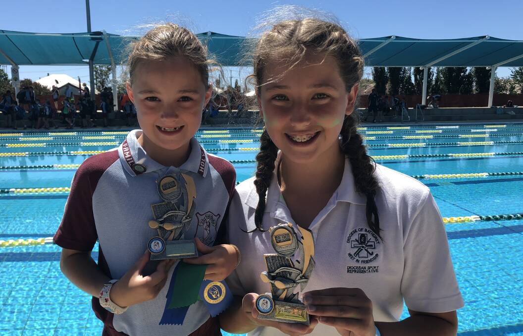 OFF TO REGION CARNIVAL: Tahlia O’Connell and Isla Fitzgerald after performing at the recent Holy Family Catholic Primary School carnival. Photo: SUPPLIED