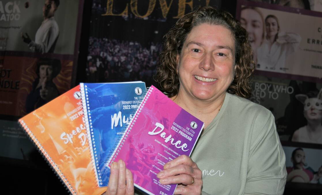 IT'S BACK: Bathurst Eisteddfod president Renee Fowler with programs for 2022 event, which starts on Saturday. Photo: CHRIS SEABROOK 081622ceisteddfod
