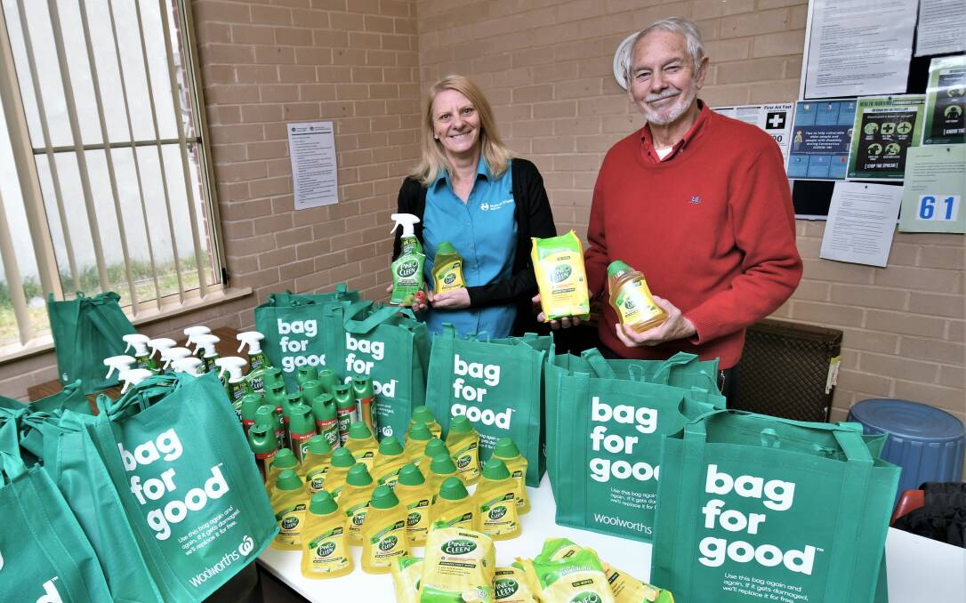 DONATE: Bathurst Meals on Wheels' Linda Roszkiewicz and president Donald Alexander with a collection of hygiene packs. Photo: CHRIS SEABROOK 