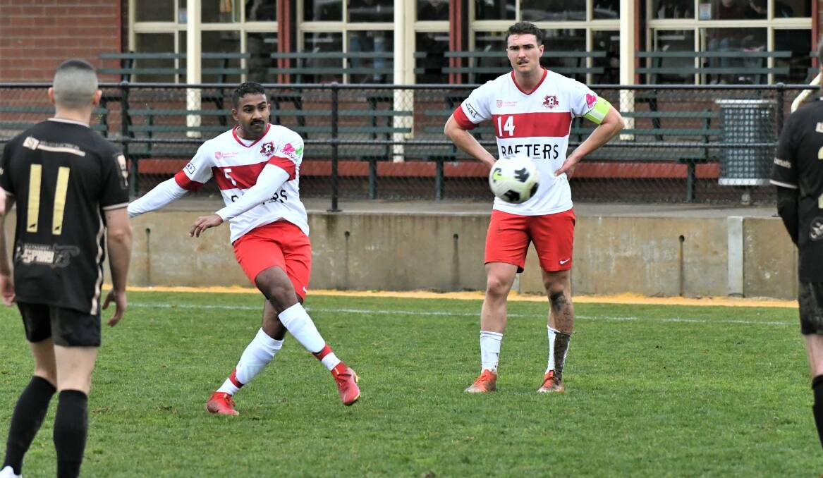 NO WPL: CSU Red's Darius Benzy strikes the ball for a free kick, with captain Callum Weafer watching on. Photo: CHRIS SEABROOK 080121csocr1
