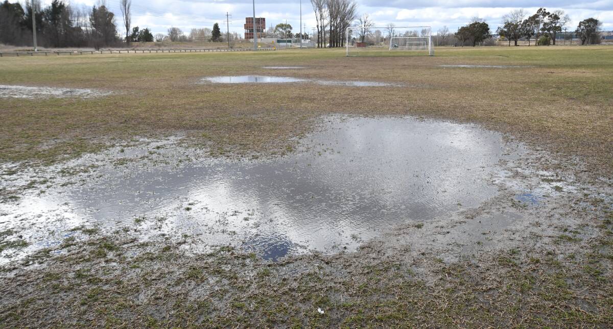 Big puddles covered Police Paddock on Tuesday afternoon. Photo: CHRIS SEABROOK