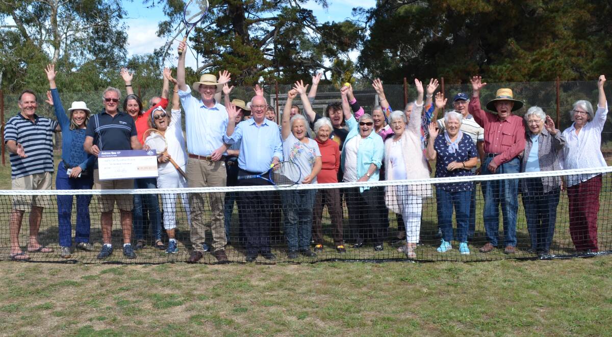 BIG WIN: Calare member Anderw Gee, Bathurst mayor Graeme Hanger and members of the Wattle Flat community on Tuesday. Photo: BRADLEY JURD