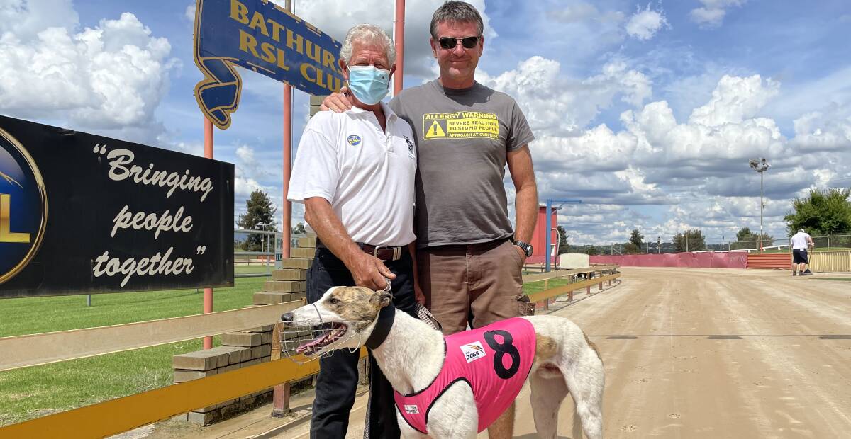 WIN: Orange trainer Bob Littlefield, trainer Al Thompson and winning dog Symbiosis won at Kennerson Park on Monday. Photo: BRADLEY JURD