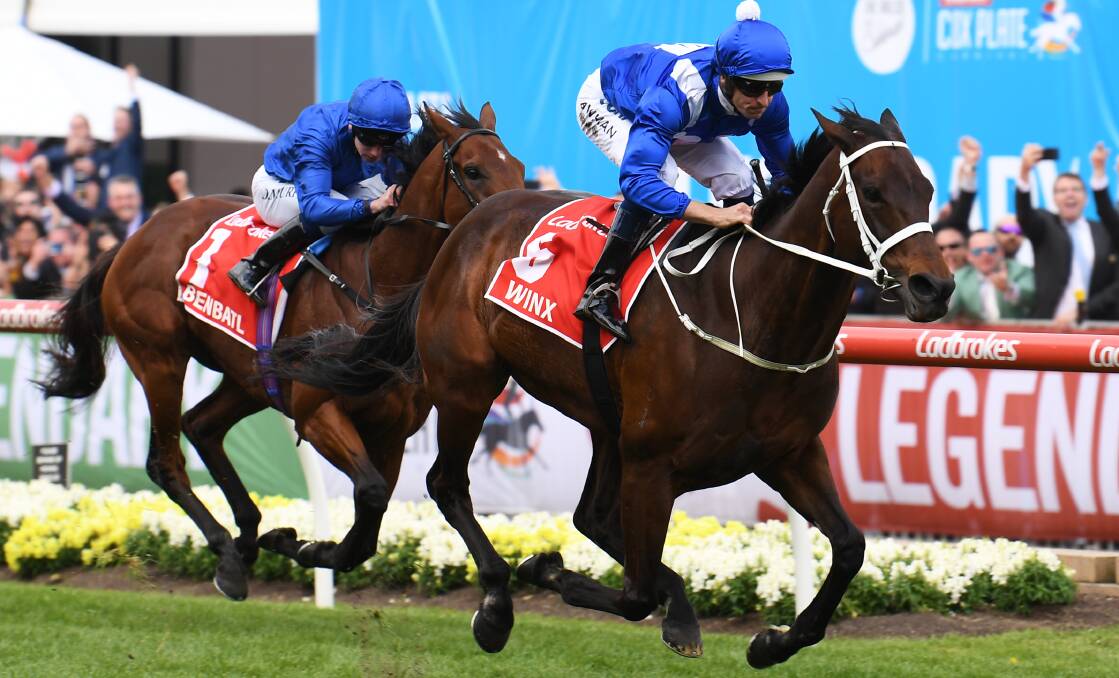 CHAMPION MARE: Hugh Bowman (right) rides Winx to victory in Saturday's Cox Plate, at Moonee Valley. Photo: AAP IMAGE/JAMES ROSS