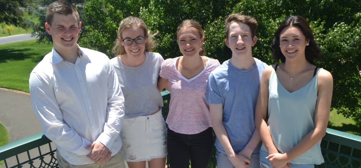 DONE AND DUSTED: All Saints' College students David Goodman, Sophie Cant, Rebecca Vann, Nicholas Brouggy and Angela Phillips, after receiving their HSC marks on Thursday. Photo: BRADLEY JURD