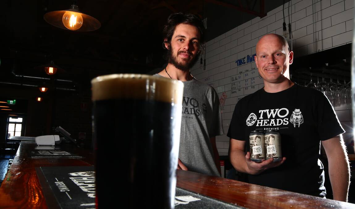 REFINED: Two Heads brewer Ian Carman and owner Greg Hedley with the brewery's refined Miller's Porter. Photo: PHIL BLATCH