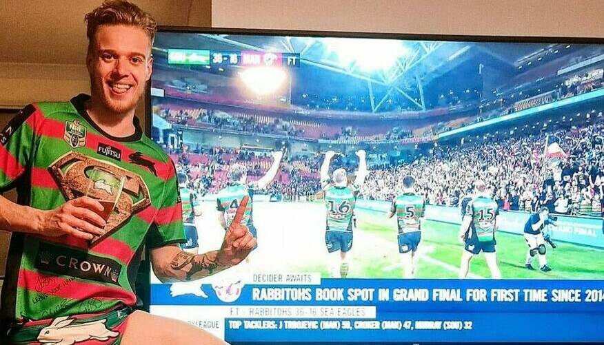 GLORY: Bathurst's Josh Stapley in his South Sydney swimmers and jersey after last week's preliminary final win. Photo: CONTRIBUTED