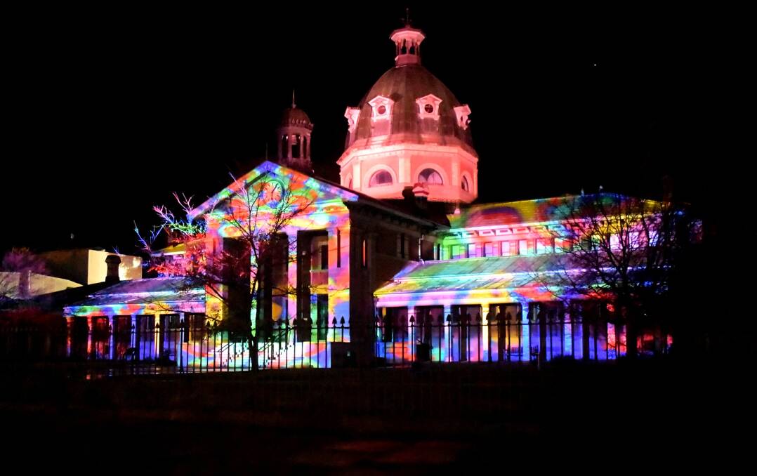 The Bathurst Court House is lit up with illumations. 
