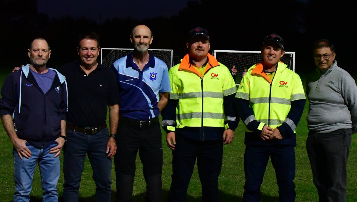 Bathurst District Football (BDF) recorder Andrew Rankin, Bathurst MP Paul Toole, BDF president Peter Scott, Central West Electrical's McCoy and Hudson White and Musco Lighting Australia's Sanjay Prakash, standing where Police Paddock has been recently lit up for the first time. Picture by Bradley Jurd