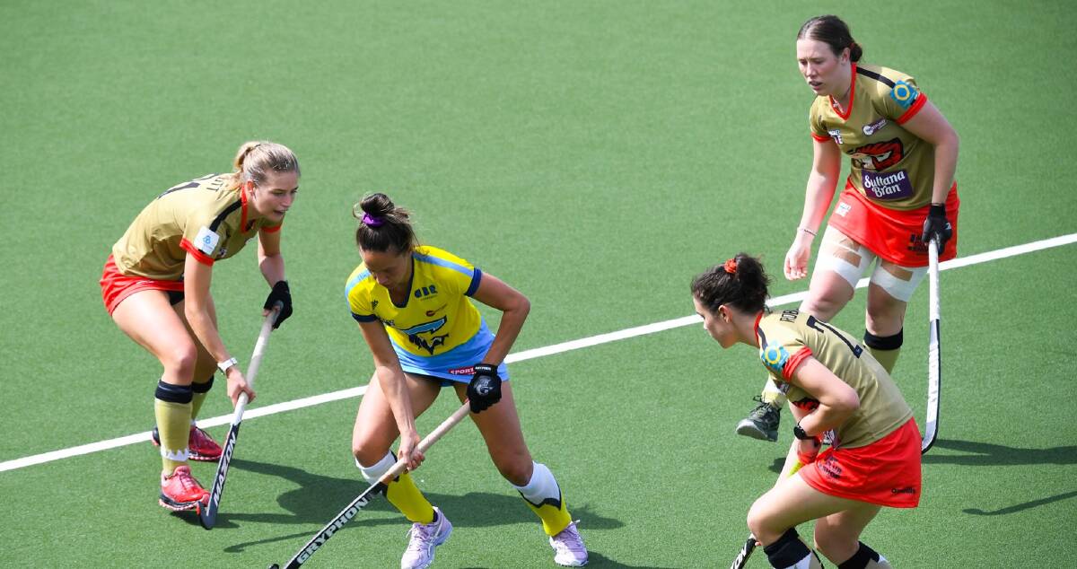 IN THE MIX: Bathurst hockey product Jess Watterson (top right) featured for NSW Pride against Canberra Chill on Saturday. Photo: AAP/NSW Pride 