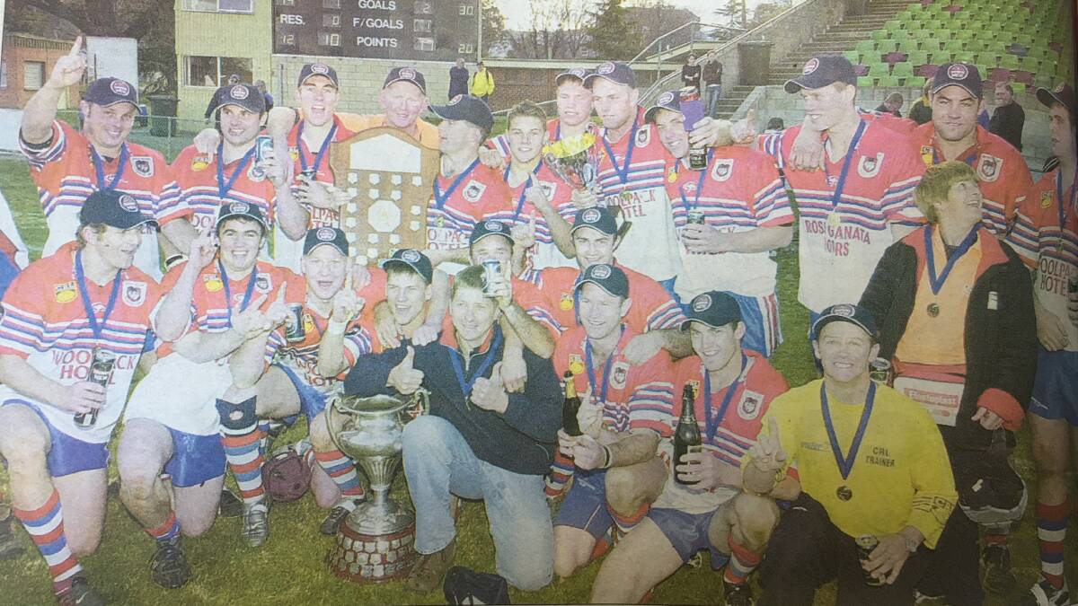FIRED UP DRAGONS: Mudgee Dragons celebrate its 2004 Group 10 premier league grand final victory. Photo: CHRIS SEABROOK