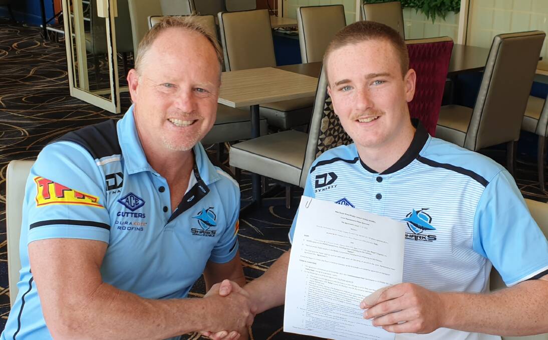 RESIGNED: Cronulla Sharks talent identification manager Glenn Brailey, with St Pat's junior Tyler Colley as he signs a new contract. 