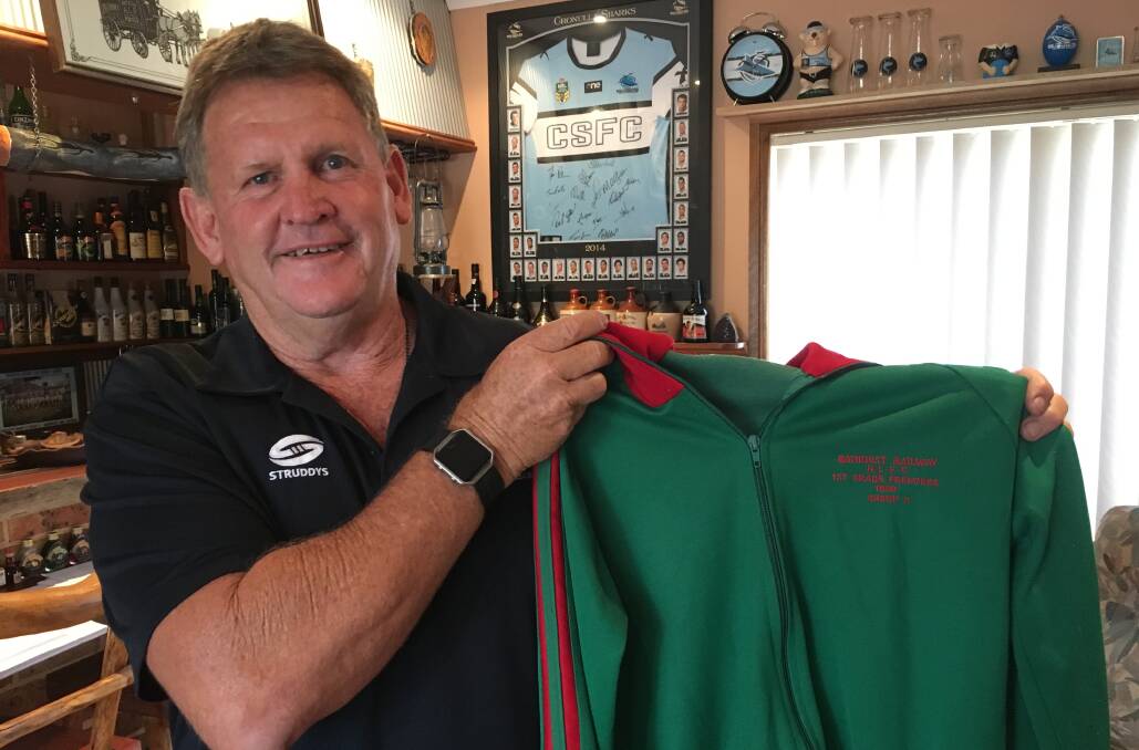 FUNDRAISER: Royce George with his 1980 Bathurst Railway winners jumper, the same year Terry Regan played for the club. Photo: BRADLEY JURD