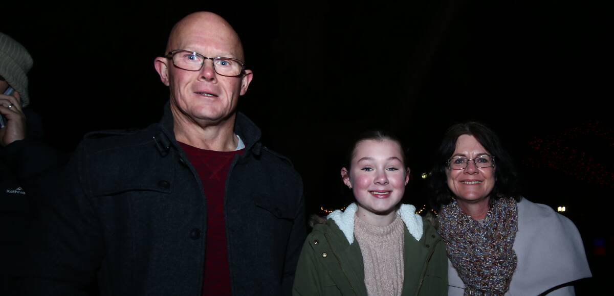 FAMILY TIME: Gary, Lana and Jenny Roberts were all at the Bathurst winter Festival on Saturday night. 071418pbbrew1