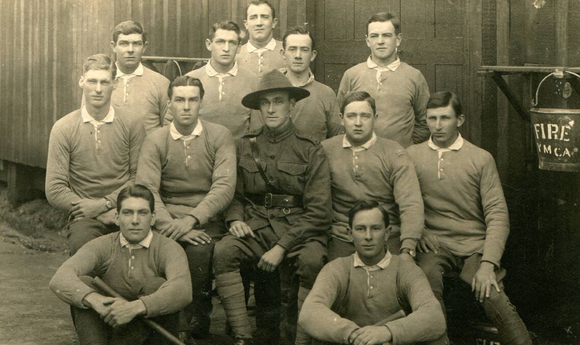 Down Time: Herbert Eric Churches, centre, with hockey team outside YMCA Recreation Hut England. 