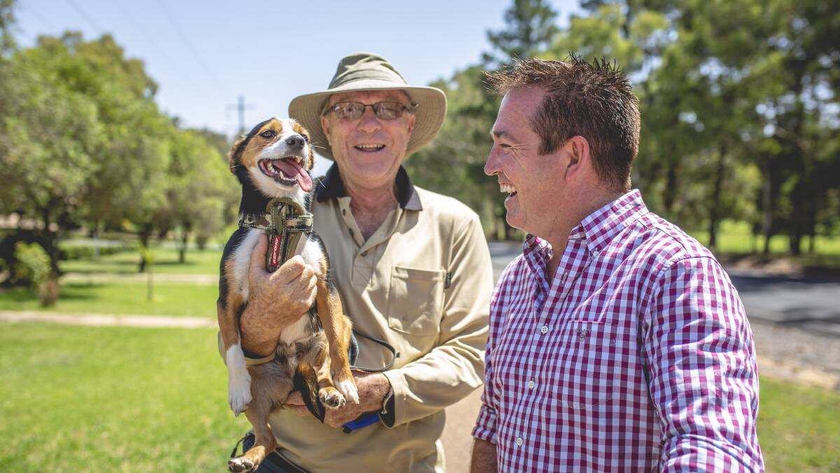 MAN'S BEST FRIEND: Member for Bathurst Paul Toole says g'day to a couple of popular Kandos identities.
