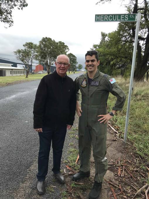 SIGN OF THE TIMES: Mayor Graeme Hanger with Squadron Leader Adrian Willey during the visit by the Hercules on the weekend.