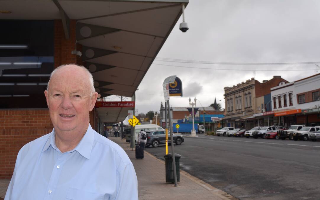 EYE IN THE SKY: Mayor Graeme Hanger near the CCTV system on Keppel Street. It is part of a safety initiative in the city.