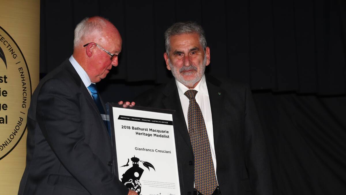 Congratulations: Mayor Graeme Hanger OAM awarding Dr Gianfranco Cresciani the Bathurst Macquarie Heritage Medal for 2018 on Saturday night.