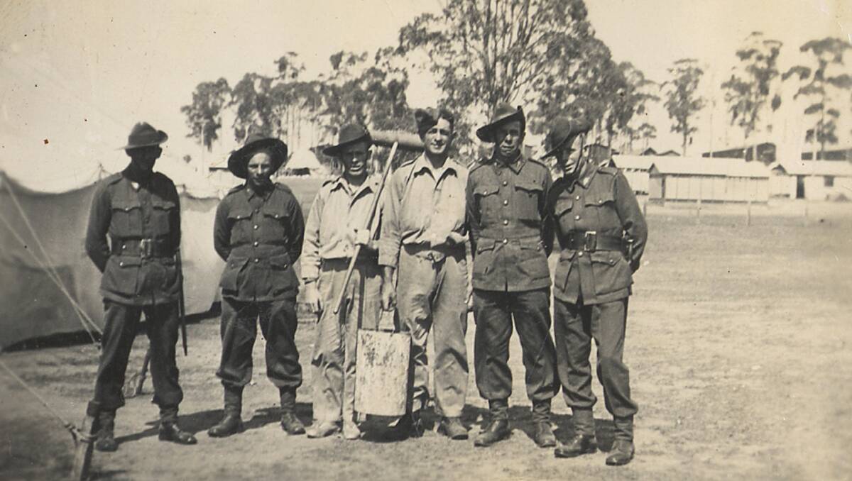 HARD YAKKA: Bathurst World War Two veteran Raymond Henry Smith and his mates with men on the latrine detail.