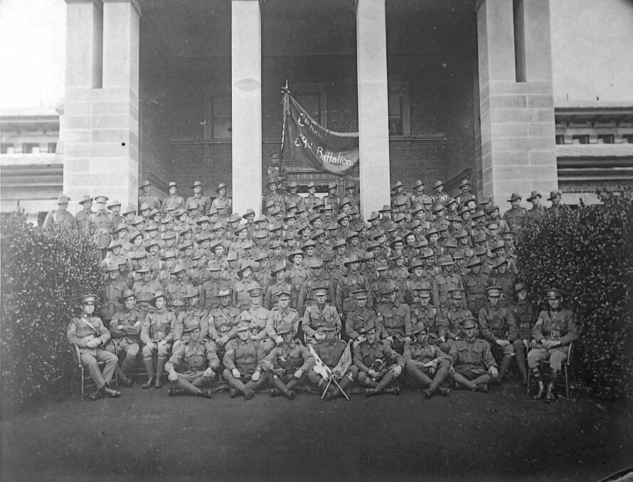 ALL TOGETHER NOW: The 54th Battalion, pictured on the steps of the Bathurst Court House, was fed from volunteers from local companies of school cadets.