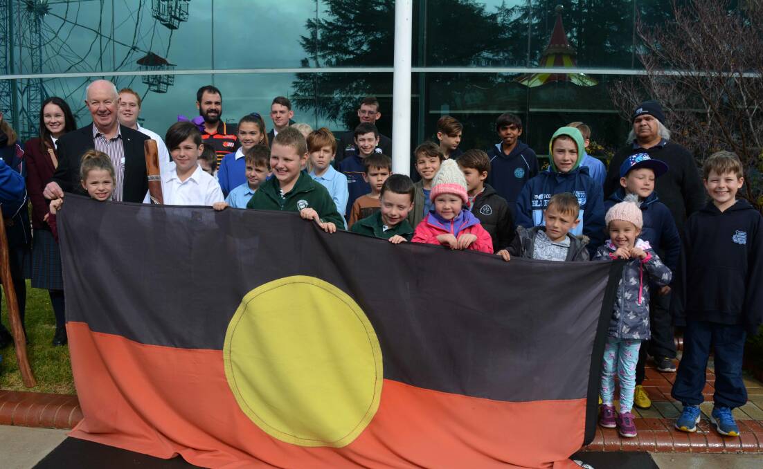 NAIDOC Week: Mayor Graeme Hanger with members of the community at the Aboriginal flag raising ceremony.