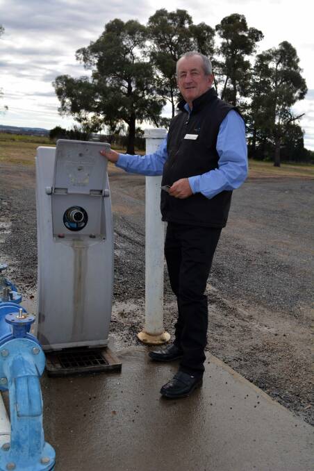 BENEFITS FLOW: Acting mayor Bobby Bourke at one of the water stations on Hereford Street.