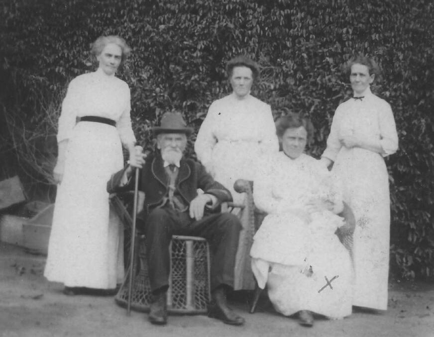 TAKE A SEAT: Retired Bathurst police magistrate Benjamin Lee Junior poses for a portrait with members of his family in the Sydney suburb of Annandale.