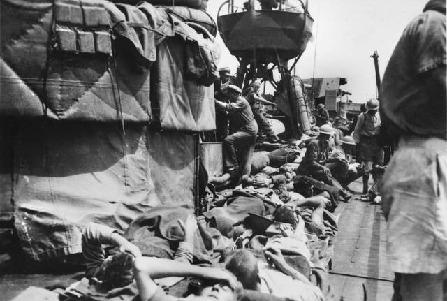 Troops bunked down on the top deck of the destroyer HMAS Vendetta on one of its 39 voyages to Tobruk. Picture: Australian War Memorial