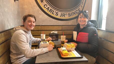 Dubbo's Carls Jr first customer Oscar Maxwell Meade and his mother Naomi Meade. Picture: Bageshri Savyasachi. 