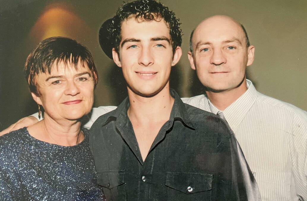 HAPPY: Cameron with his parents Carolyn and Rick Lean on his 21st birthday. Picture: SUPPLIED 