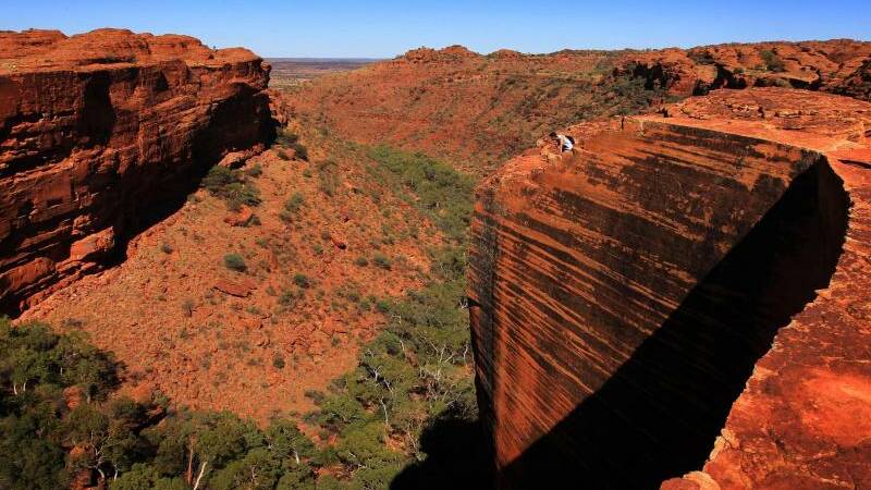 The landscape of Kings Canyon is illustrated with brilliant shades of orange
