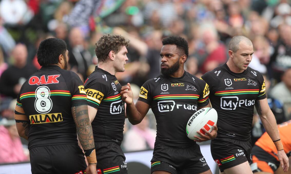 Penrith Panthers' Sunia Turuva (with ball) is congratulated by his teammates after scoring in the April 20, 2024 match at Carrington Park. Picture by Phil Blatch