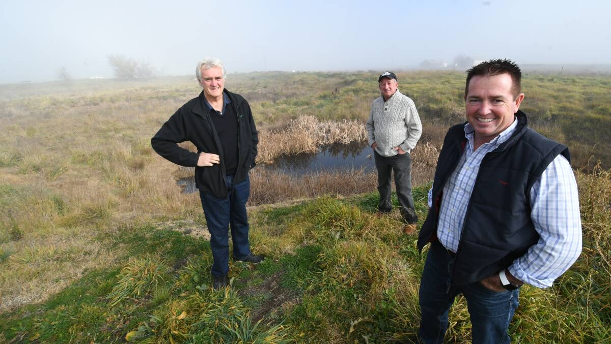 VISION: Councillor John Fry, mayor Bobby Bourke and Bathurst MP Paul Toole at the former brick pit off Hereford Street. Photo: CHRIS SEABROOK 061520cwetland1