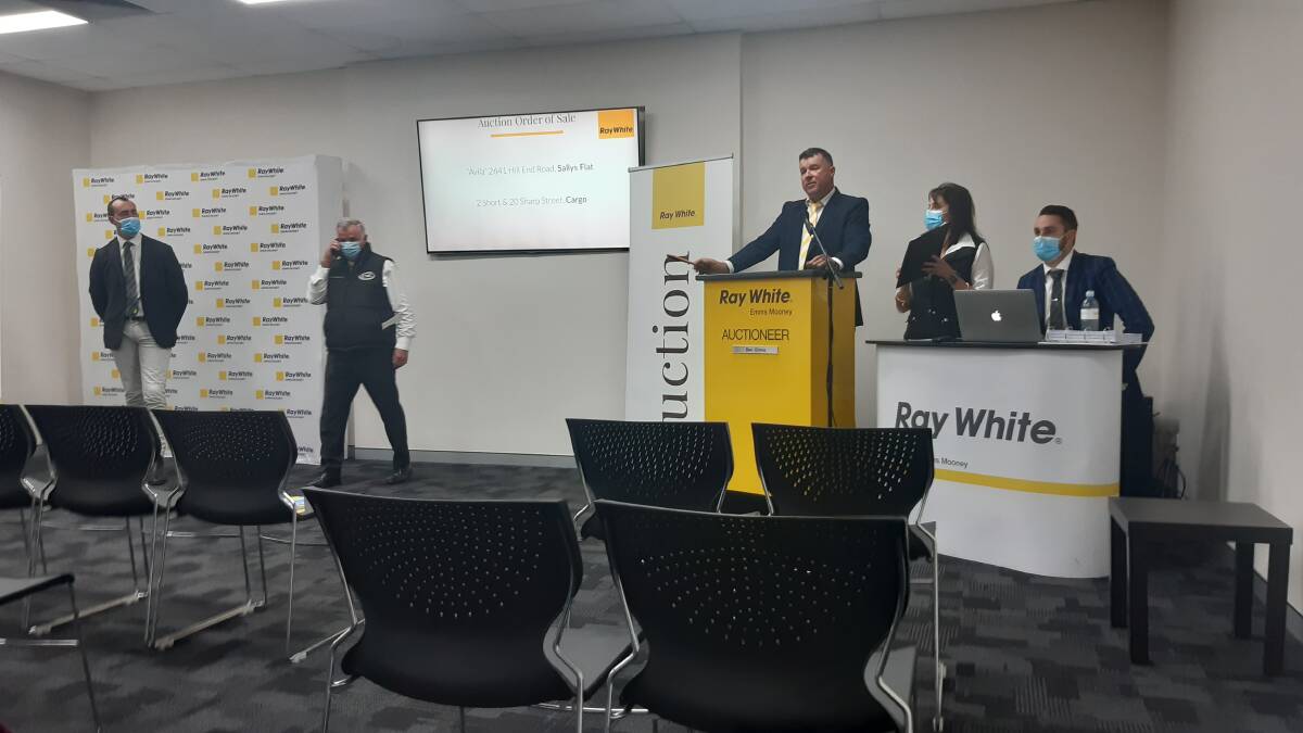 GOING ONCE: Ben Emms and the Ray White Emms Mooney team in action at the "Avila" auction last week.
