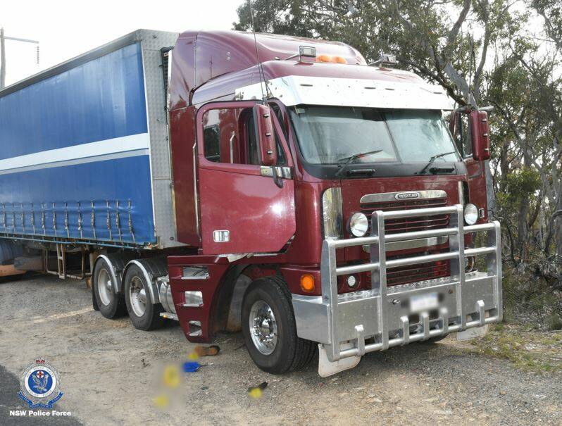 AMBUSH: A group of men allegedly forced entry to the cabin of a truck at Mount Lambie, between Bathurst and Lithgow, in September. Photo: NSW POLICE