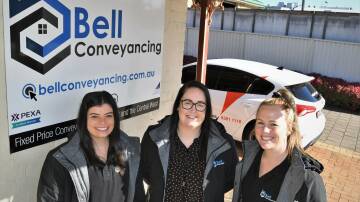 Kristy Bell (middle), pictured with Bell Conveyancing's Amy Vickers and Kate Gullifer, has been named as a finalist in the AusMumpreneur Awards. Photo: CHRIS SEABROOK 