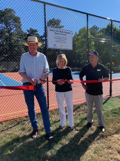 THAT'S OFFICIAL: Member for Calare Andrew Gee, Helen Gourlay Cawley and mayor Bobby Bourke cut the ribbon at the revamped Wattle Flat sports courts.