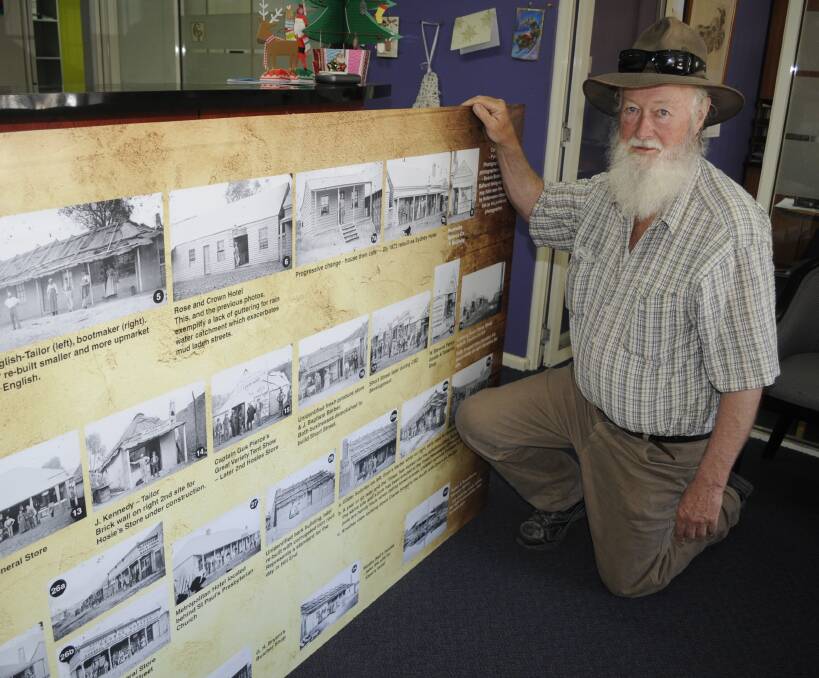 A VISUAL RECORD: Hill End historian Malcolm Drinkwater with one of his newly completed history boards. Photo: CHRIS SEABROOK 122116chillend1