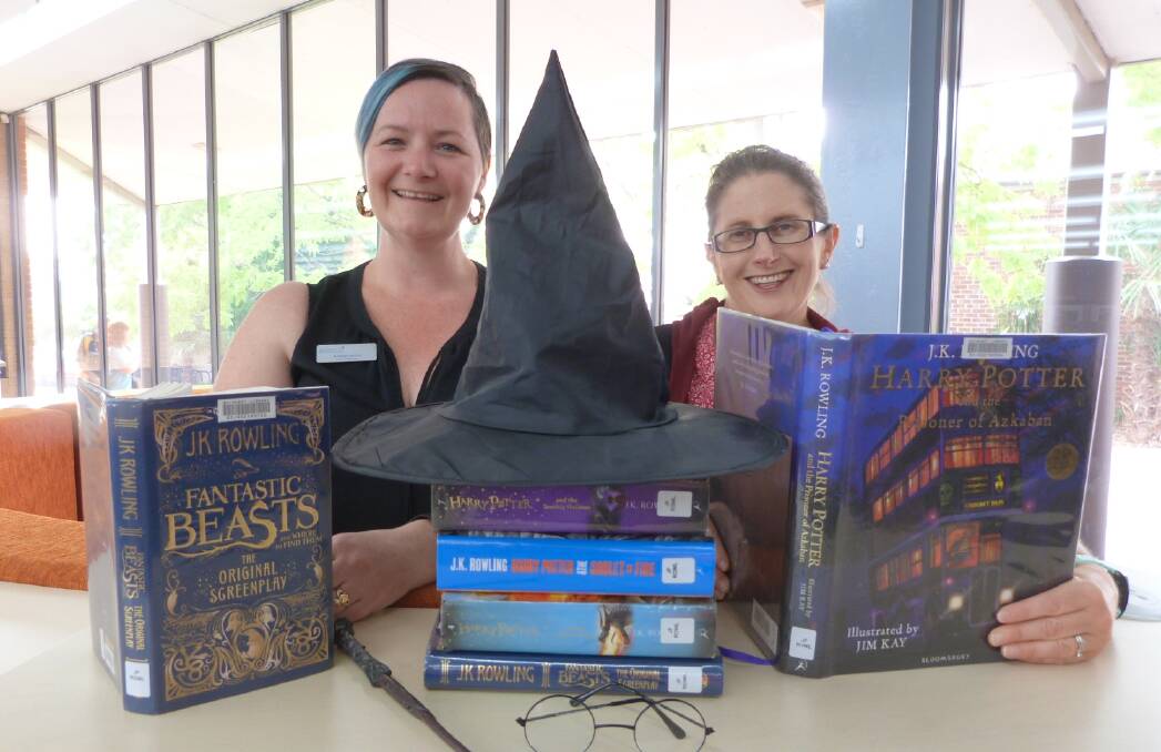
MAD ABOUT HARRY: Bathurst Library staff Rhiannon Mijovic and Rebecca Coello are cramming for the Harry Potter Quizz-itch that will be held as part of the library's January school holiday program.